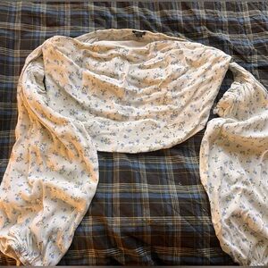 White and blue cropped floral blouse with ruffle detail